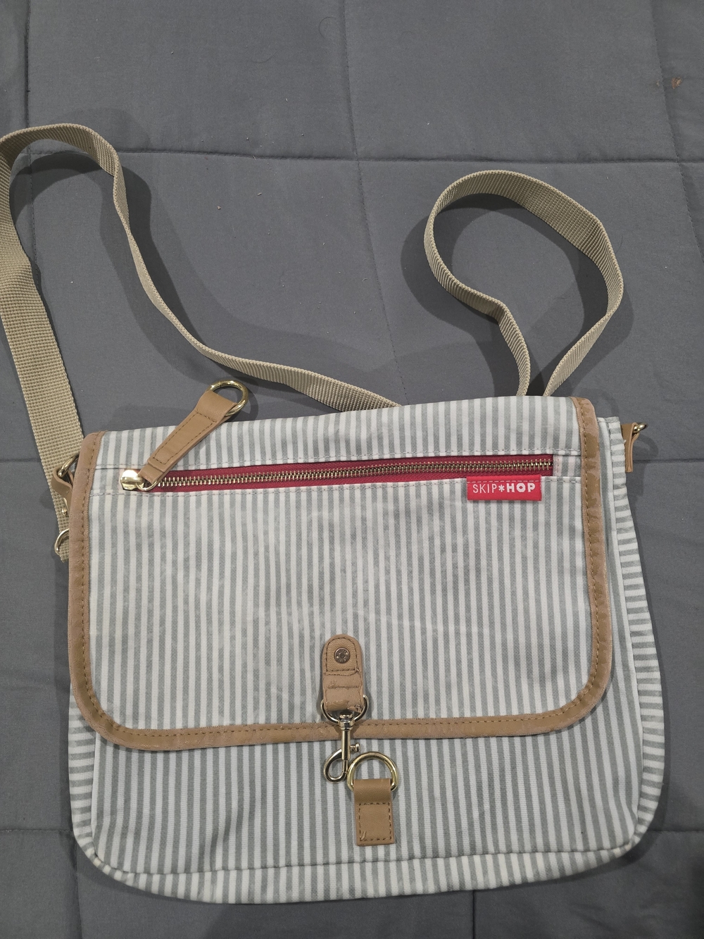 Skip Hop Gray and White Striped Messenger Bag with Tan Trim and Red Accent